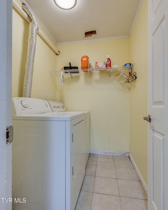 312 Timberlane Rd, Bristol, TN 37620 - washroom with independent washer and dryer, ornamental molding, light tile patterned floors, and a textured ceiling
