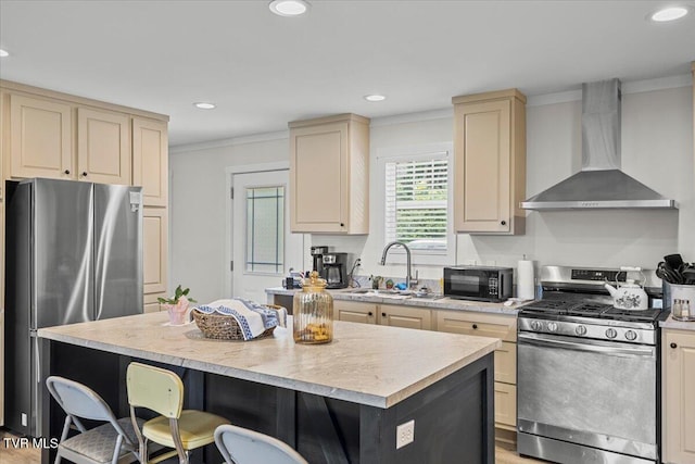145 Oakwood Dr Way, Newport, TN 37821 - kitchen with stainless steel appliances, wall chimney range hood, a breakfast bar, cream cabinets, and light countertops