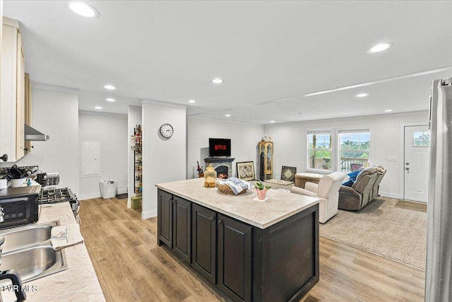 145 Oakwood Dr Way, Newport, TN 37821 - kitchen featuring light countertops, wall chimney range hood, a kitchen island, dark cabinets, and recessed lighting