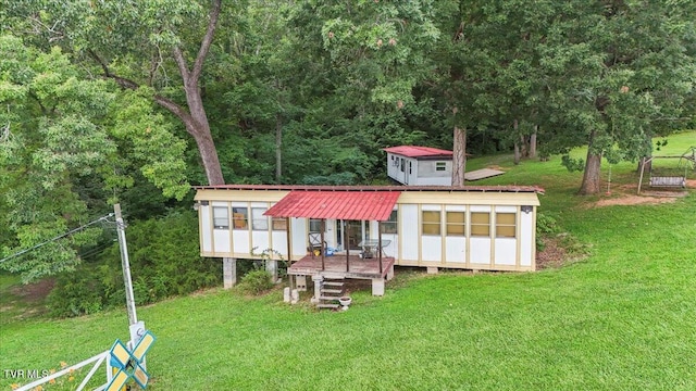 145 Oakwood Dr Way, Newport, TN 37821 - view of front of property featuring a front lawn, a metal roof, and a shed