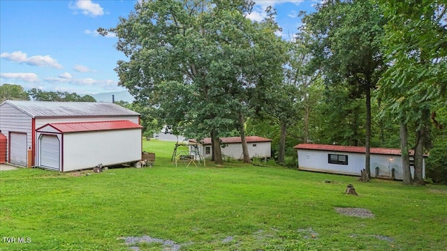 145 Oakwood Dr Way, Newport, TN 37821 - view of grassy yard featuring an outbuilding and a detached garage