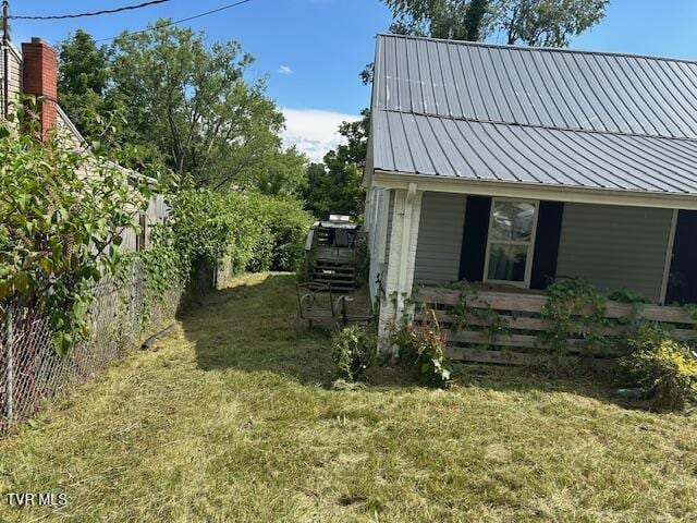 938 Barker St, Bristol, TN 37620 - view of home's exterior with a metal roof and a yard