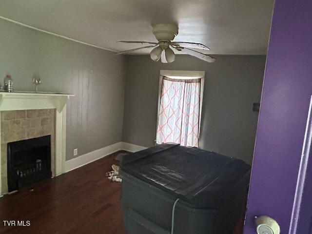 938 Barker St, Bristol, TN 37620 - living area with a ceiling fan, wood finished floors, and a tiled fireplace