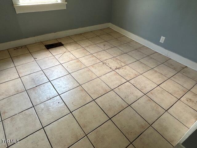 938 Barker St, Bristol, TN 37620 - empty room featuring light tile patterned floors and baseboards