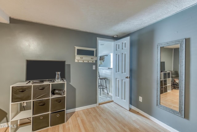218 Kirkwood St, Glade Spring, VA 24340 - bedroom featuring wood finished floors and a textured ceiling