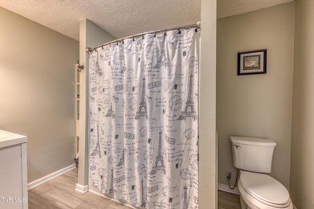 218 Kirkwood St, Glade Spring, VA 24340 - bathroom with a textured ceiling, wood finished floors, vanity, and a shower with curtain