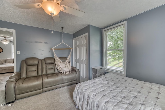 218 Kirkwood St, Glade Spring, VA 24340 - bedroom with a textured ceiling, a closet, a ceiling fan, and carpet flooring