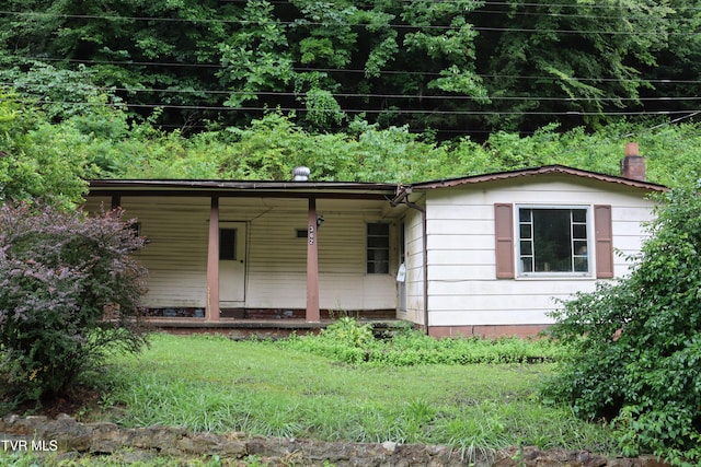 362 Rakes Ridge Rd, Birchleaf, VA 24220 - ranch-style home with a porch and a chimney