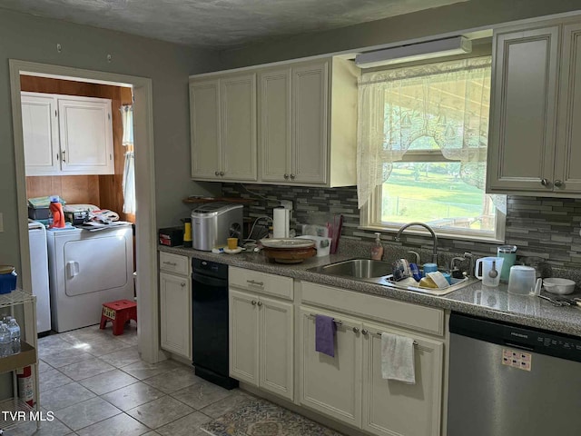 2818 Dungannon Rd, Coeburn, VA 24230 - kitchen with dishwasher, washing machine and dryer, tasteful backsplash, light tile patterned floors, and white cabinets
