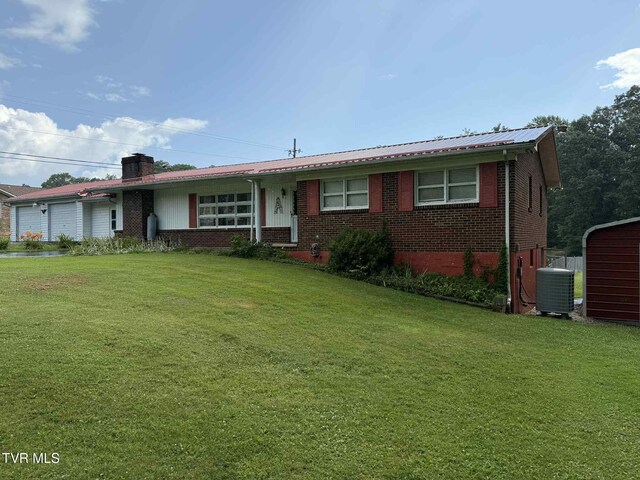 2818 Dungannon Rd, Coeburn, VA 24230 - single story home with an attached garage, brick siding, a front lawn, a chimney, and a metal roof