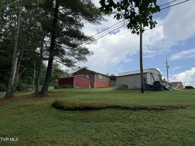 2818 Dungannon Rd, Coeburn, VA 24230 - view of grassy yard with an outbuilding and a detached garage
