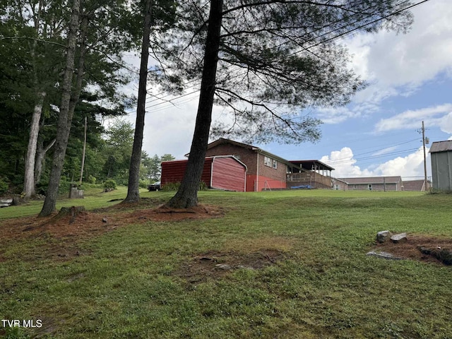 2818 Dungannon Rd, Coeburn, VA 24230 - view of grassy yard featuring a garage, a barn, and an outbuilding