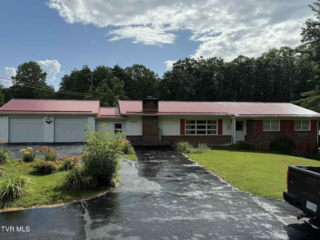 2818 Dungannon Rd, Coeburn, VA 24230 - single story home with driveway, brick siding, a garage, a metal roof, and a front lawn