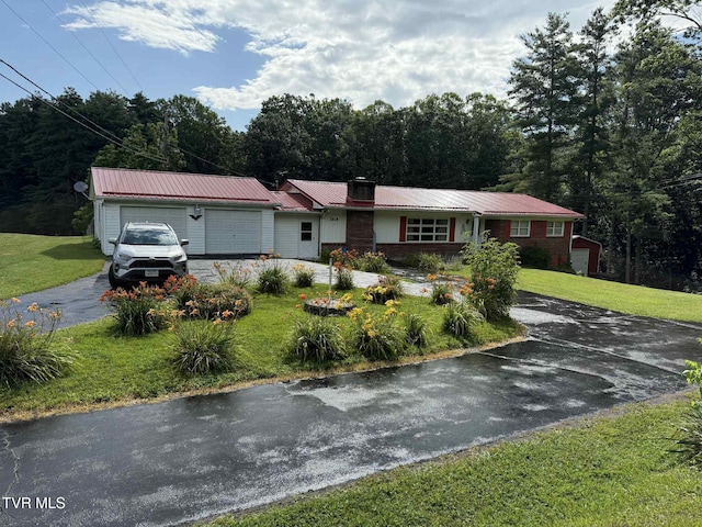 2818 Dungannon Rd, Coeburn, VA 24230 - ranch-style house with a garage, asphalt driveway, and a front lawn