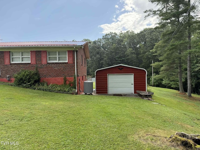 2818 Dungannon Rd, Coeburn, VA 24230 - view of property exterior with a yard, an outdoor structure, a garage, a metal roof, and brick siding