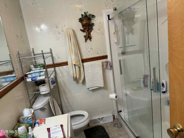 2818 Dungannon Rd, Coeburn, VA 24230 - full bathroom featuring tile walls, a stall shower, and tile patterned flooring