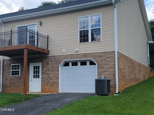 63 Whisper Bnd Unit 1, Johnson City, TN 37604 - view of side of home featuring an attached garage, a balcony, asphalt driveway, stone siding, and roof with shingles