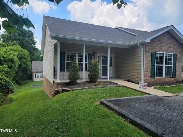 63 Whisper Bnd Unit 1, Johnson City, TN 37604 - ranch-style home featuring a front lawn, covered porch, and roof with shingles