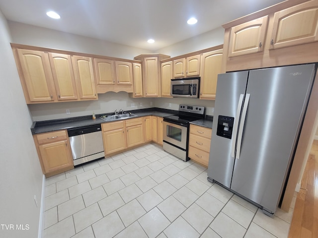 63 Whisper Bnd Unit 1, Johnson City, TN 37604 - kitchen with stainless steel appliances, light brown cabinetry, dark countertops, light tile patterned floors, and recessed lighting