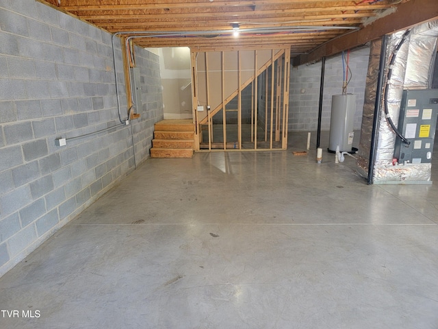63 Whisper Bnd Unit 1, Johnson City, TN 37604 - unfinished below grade area with water heater, concrete block wall, and stairs