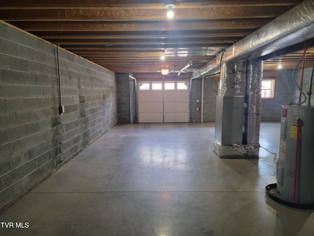 63 Whisper Bnd Unit 1, Johnson City, TN 37604 - garage featuring electric water heater, concrete block wall, and heating unit