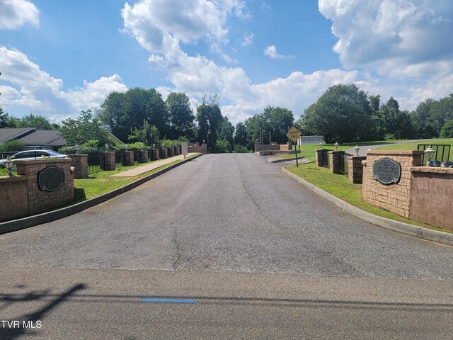 63 Whisper Bnd Unit 1, Johnson City, TN 37604 - view of asphalt road with traffic signs and curbs