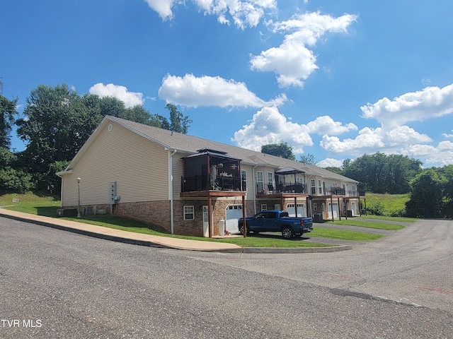 63 Whisper Bnd Unit 1, Johnson City, TN 37604 - view of side of home with brick siding and driveway