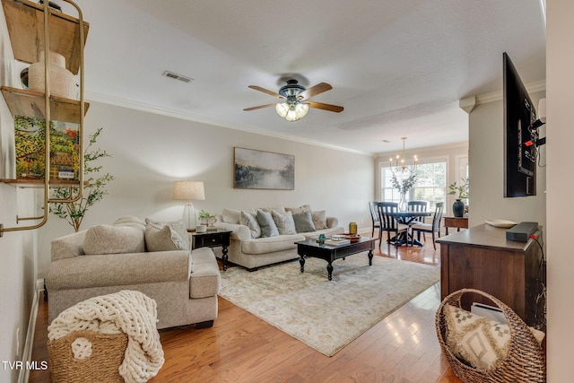 417 Piper Gln, Gray, TN 37615 - living room featuring light wood-style flooring, a ceiling fan, crown molding, and a chandelier