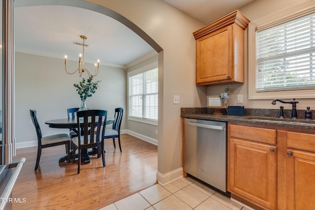 417 Piper Gln, Gray, TN 37615 - kitchen with dishwasher, arched walkways, a chandelier, crown molding, and brown cabinets