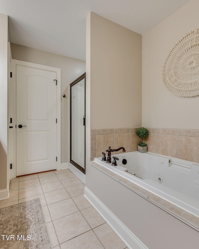 417 Piper Gln, Gray, TN 37615 - bathroom with a shower stall, a whirlpool tub, and tile patterned flooring