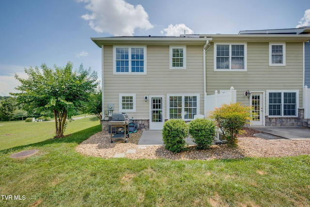 417 Piper Gln, Gray, TN 37615 - rear view of house featuring a patio area, a yard, and stone siding