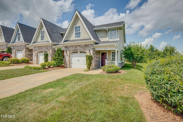 417 Piper Gln, Gray, TN 37615 - view of front of house featuring concrete driveway, an attached garage, a front yard, stone siding, and a shingled roof
