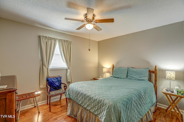107 Dover Ln, Bristol, TN 37620 - bedroom featuring wood finished floors, a ceiling fan, and a textured ceiling