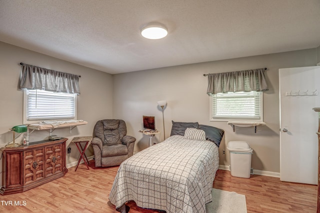 107 Dover Ln, Bristol, TN 37620 - bedroom with multiple windows and wood finished floors