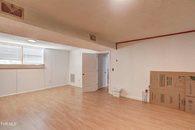 107 Dover Ln, Bristol, TN 37620 - basement with a textured ceiling and light wood-type flooring