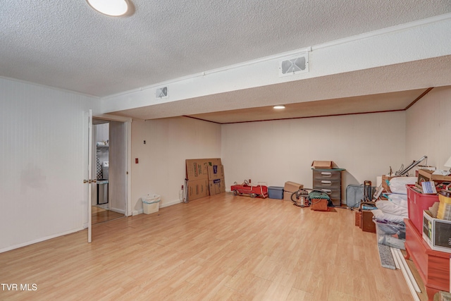 107 Dover Ln, Bristol, TN 37620 - finished basement with wood finished floors, a textured ceiling, and crown molding