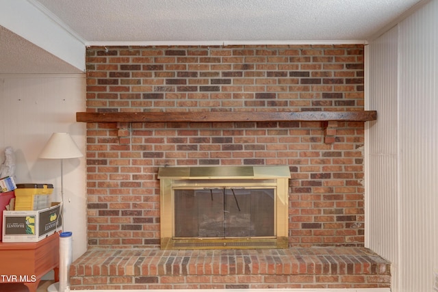 107 Dover Ln, Bristol, TN 37620 - detailed view of a brick fireplace, ornamental molding, and a textured ceiling