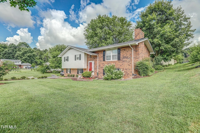 107 Dover Ln, Bristol, TN 37620 - raised ranch with brick siding, a chimney, and a front lawn