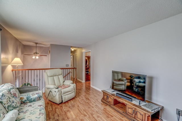 107 Dover Ln, Bristol, TN 37620 - living area featuring light wood finished floors, ceiling fan, and a textured ceiling