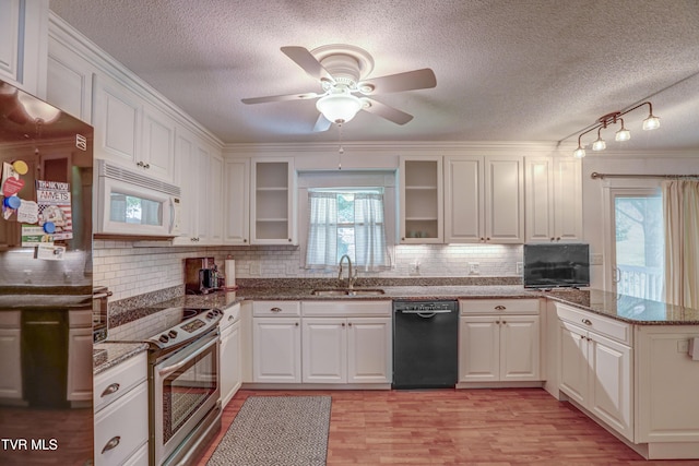 107 Dover Ln, Bristol, TN 37620 - kitchen featuring stainless steel electric stove, dishwasher, white microwave, a textured ceiling, and a peninsula