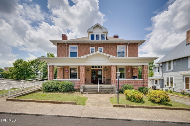 522 Alabama St, Bristol, TN 37620 - traditional style home with covered porch, a chimney, and brick siding