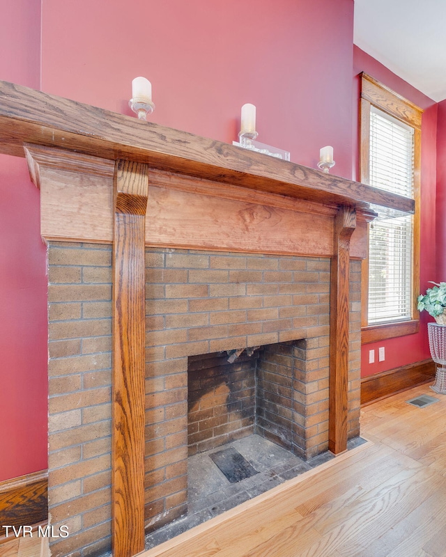 522 Alabama St, Bristol, TN 37620 - detailed view of wood finished floors and a brick fireplace