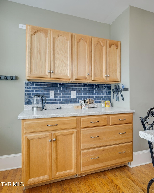 522 Alabama St, Bristol, TN 37620 - kitchen featuring light brown cabinets, light countertops, backsplash, and light wood finished floors