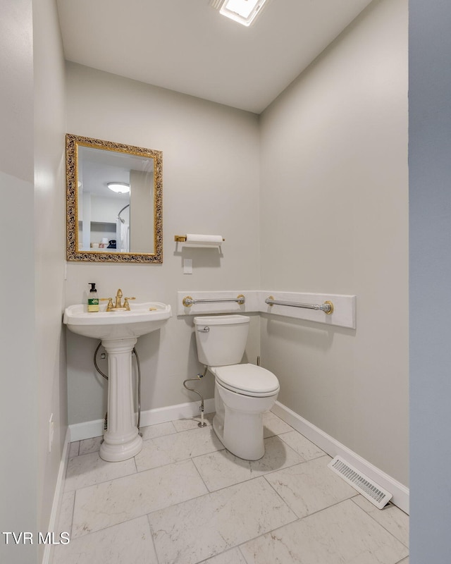 522 Alabama St, Bristol, TN 37620 - bathroom featuring toilet and marble finish flooring