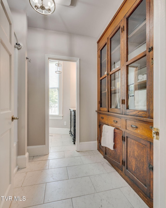 522 Alabama St, Bristol, TN 37620 - corridor featuring a chandelier and light marble finish flooring