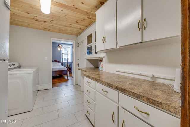 522 Alabama St, Bristol, TN 37620 - laundry room featuring wood ceiling, cabinet space, light tile patterned floors, and washer and clothes dryer