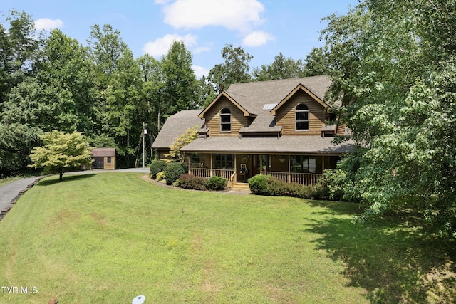 2019 Ridgeview Dr, Big Stone Gap, VA 24219 - view of front of home with a porch, a front yard, a shingled roof, and driveway
