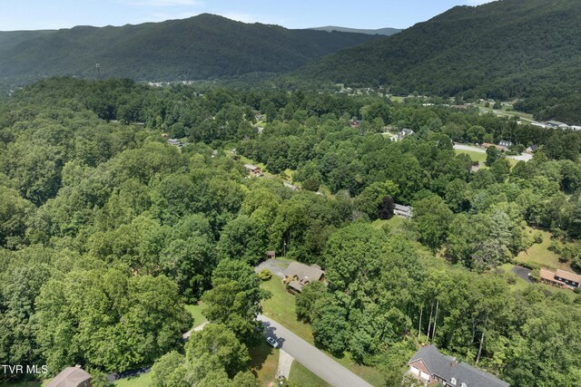 2019 Ridgeview Dr, Big Stone Gap, VA 24219 - aerial view of property and surrounding area featuring a forest and a mountainous background