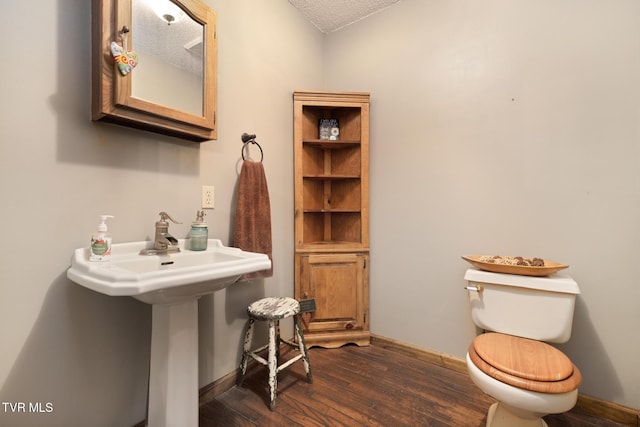 2019 Ridgeview Dr, Big Stone Gap, VA 24219 - half bathroom featuring wood finished floors and a textured ceiling