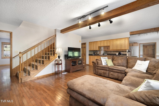 2019 Ridgeview Dr, Big Stone Gap, VA 24219 - living room featuring stairway, wood-type flooring, and a textured ceiling
